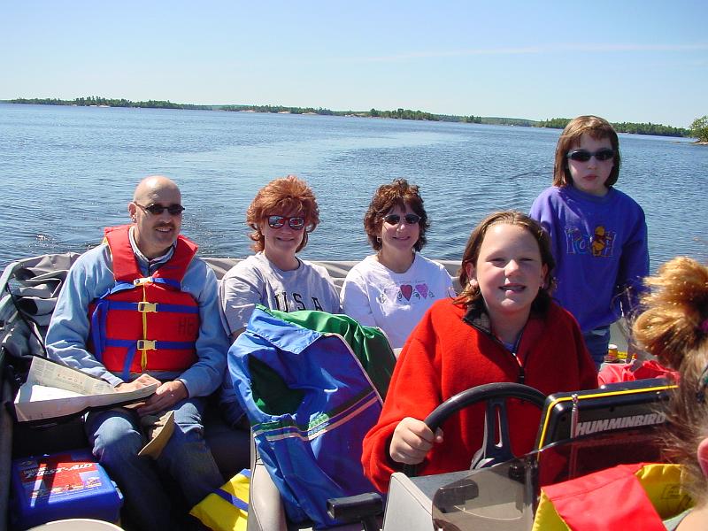 DSC02906.JPG - 2001 - Lake Kabetogama, Voyageurs NP, MN - Stephanie driving the pontoon boat while Uncle Michael, Cathy, Aunt Barbara and Hannah watch
